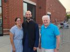 Church leader with guests at the Big Greek Food Fest of Niles