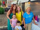 Volunteer with family at St. Nectarios Greek Fest in Palatine