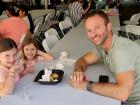 Family enjoying the St Demetrios Greek Fest in Elmhurst