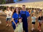 Volunteer with family at the St Demetrios Greek Fest in Elmhurst