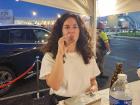 Participant enjoying cigar at St Demetrios Greek Fest in Elmhurst