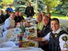 Church leader and police officers at the St Demetrios Greek Fest in Elmhurst