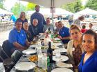 Church leader with guests at St Nectarios Greek Fest in Palatine