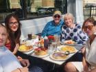 Family enjoying breakfast on the outdoor patio at Maple Butter Cafe in Plainfield Family enjoying breakfast on the outdoor patio at Maple Butter Cafe in Plainfield