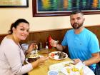 Couple enjoying the famous gyros at The Works Gyros in Glenview