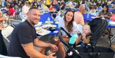 Family enjoying the Big Greek Food Fest in Niles