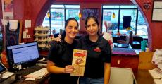 Friendly staff serving lunch customers at Brandy's Gyros in Hanover Park