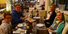 Family enjoying dinner at Brousko Authentic Greek Cuisine in Schaumburg