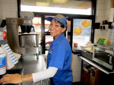 Friendly drive-thru worker at Charcoal Delights Restaurant in Des Plaines