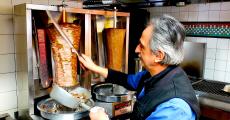 Slicing the famous homemade gyros at Charcoal Flame Grill in Morton Grove