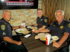 Police officers enjoying lunch at Dengeos Restaurant in Skokie