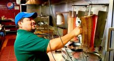 Slicing the famous gyros at Goodi's Restaurant in Niles
