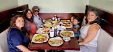 Family enjoying breakfast at Maple Butter Cafe in Plainfield