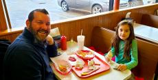 Father & daughter enjoying lunch at Nick's Drive In Restaurant in Chicago