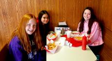 Friends enjoying lunch at Nick's Drive-In Restaurant in Chicago