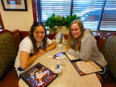 Friends enjoying breakfast at Omega Restaurant & Pancake House in Downers Grove