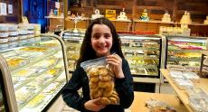 Happy young customer at Papagalino Cafe & Pastry Shop in Niles