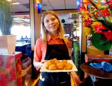 Serving the famous Loukoumades at Papagalino Cafe & Pastry Shop in Niles