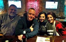 Friends enjoying drinks at Rocky's American Grill in Prospect Heights