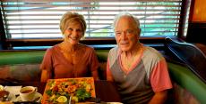 Happy couple enjoying dinner at Rose Garden Cafe in Elk Grove Village