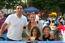 Family enjoying the Lincoln Square Greek Fest at St. Demetrios in Chicago