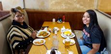 Mom and daughter enjoying breakfast at Tasty Waffle Restaurant in Romeoville