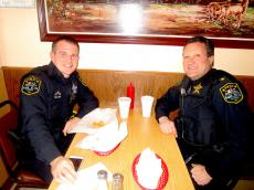 Police officers enjoying gyros at The Works Restaurant in Glenview