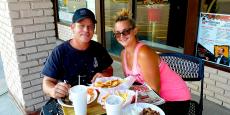 Couple enjoying lunch on the patio at The Works Gyros in Glenview