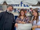 Church leader with festival staff at The Big Greek Food Fest in Niles