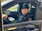 Police officer in drive-thru at Charcoal Delights Restaurant in Chicago