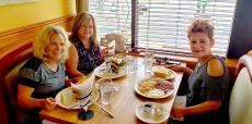 Friends enjoying breakfast at Apple Villa Pancake House in Hoffman Estates