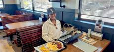 Happy customer enjoying lunch at Billy Boy's Restaurant in Chicago Ridge