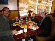 Mom, dad and daughter enjoying a hearty breakfast at Cary's Family Restaurant in Cary