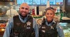 Police officers enjoying lunch at Charcoal Delights Restaurant in Chicago