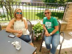 Friends enjoying breakfast on the patio at Downer's Delight in Downers Grove