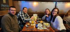 Friends enjoying dinner at Ellwood Steak and Fish House in DeKalb