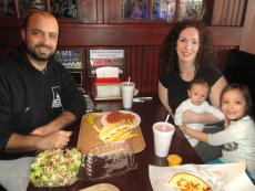 Family having dinner at Kostas Gyros Restaurant in Algonquin