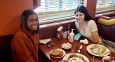 Friends enjoying breakfast at Lumes Pancake House in Chicago