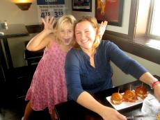 Mom and daughter enjoying a casual lunch at Manny's Ale House in Elmhurst