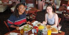 Friends enjoying breakfast at Maple Butter Cafe in Plainfield