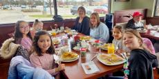 Family enjoying breakfast at Maple Butter Cafe in Plainfield