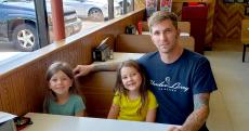 Dad and daughters enjoying lunch at Nick's Drive-In Restaurant Chicago