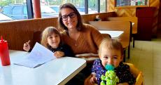 Family enjoying lunch at Nick's Drive-In Restaurant in Chicago