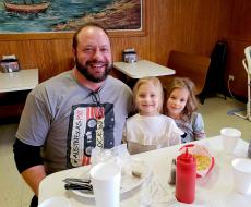 Family enjoying lunch at Nick's Drive In Restaurant in Chicago