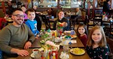 Family enjoying lunch at Omega Restaurant & Pancake House in Schaumburg