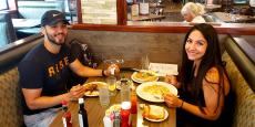 Couple enjoying breakfast at Omega Restaurant & Pancake House in Schaumburg