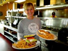 Friendly waitress serving sandwiches at Pilot Pete's Restaurant in Schaumburg