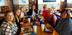 Friends enjoying lunch at QP Greek Food With a Kick in Hoffman Estates