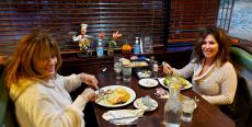 Friends enjoying dinner at Rose Garden Cafe in Elk Grove Village