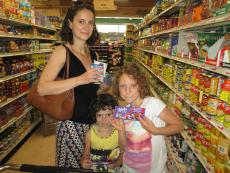 Family shopping for groceries at Village Market Place in Skokie